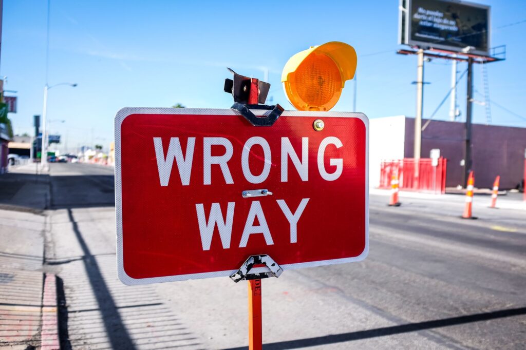 A red sign saying "Wrong way".
