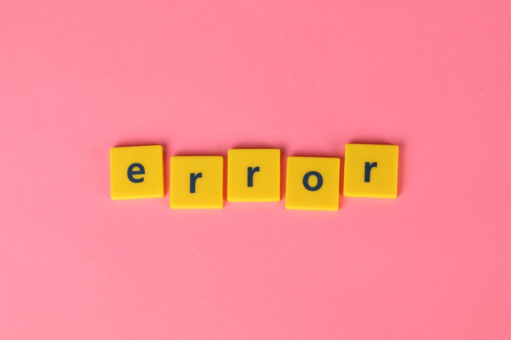 Yellow lettering saying "error"on a pink background.