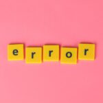 Yellow lettering saying "error"on a pink background.